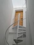 Winding staircase to bedroom